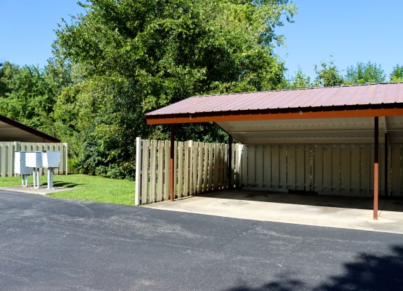 a covered parking garage with a red roof
