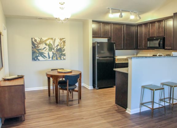 a kitchen and dining area in a 555 waverly unit
