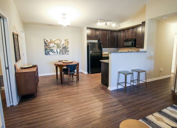 a view of the kitchen and living room from the dining area