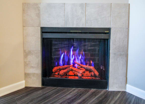 a fireplace with a tv above it