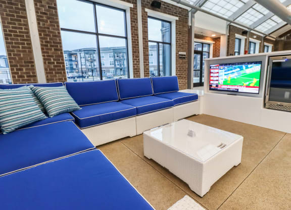 a seating area with a television and a coffee table
