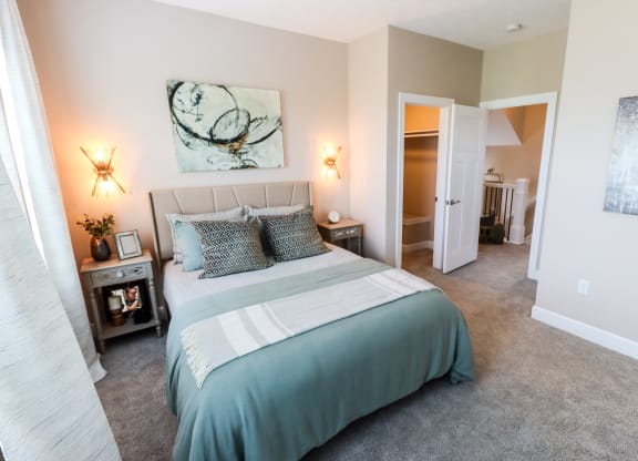 a bedroom with a bed and two night stands