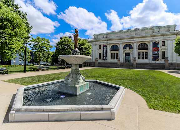a fountain in front of a building campus