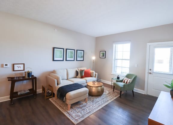 a living room with a couch and a chair