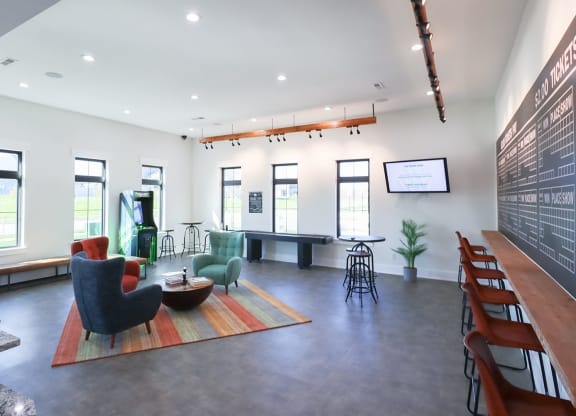 a large room with chairs and a table in the middle