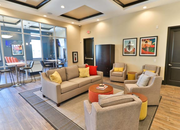 a living room with couches and chairs and a coffee table
