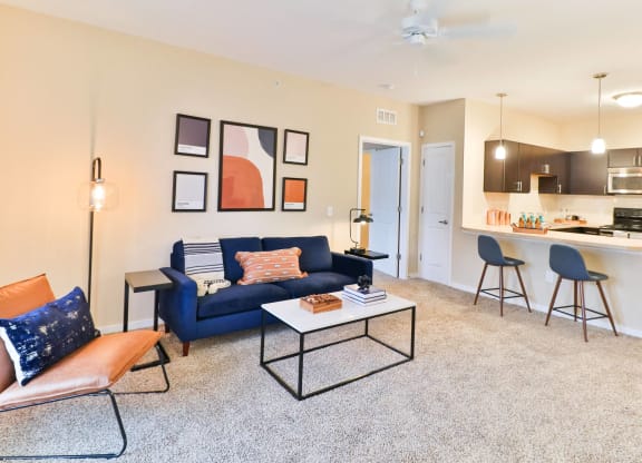 a living room with a blue couch and a coffee table