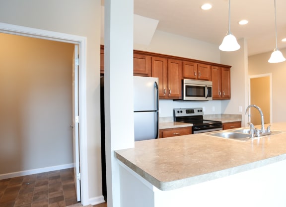 a kitchen with a large counter top and a sink