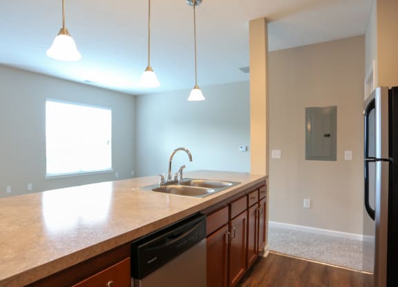 a kitchen with a large counter top and a sink
