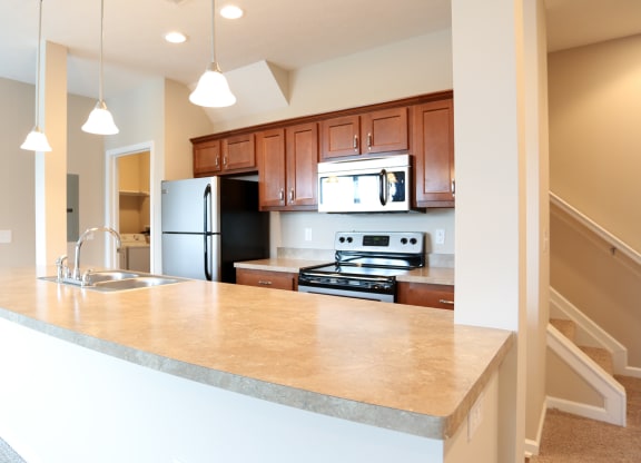a kitchen with a large counter top and a sink