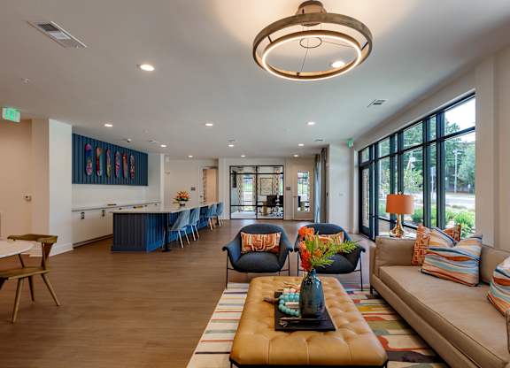 A living room with a long sofa and a coffee table.