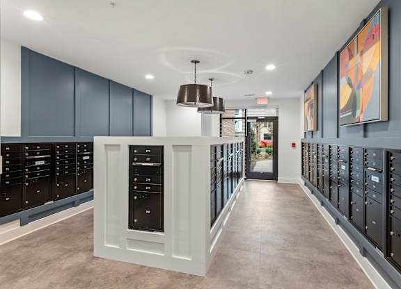 A hallway with a white door and a grey floor.