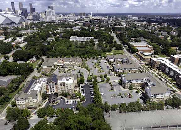 A bird's eye view of a city with a mix of residential and commercial buildings.