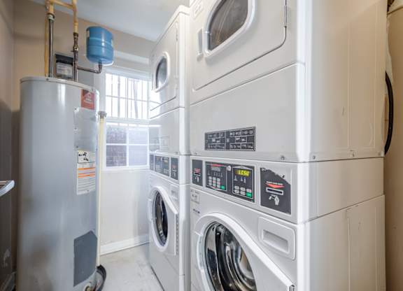 A row of washing machines in a laundromat.