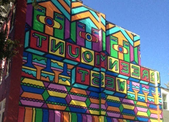 A colorful mural on a wall with the words "STUDIO 33" written on it.