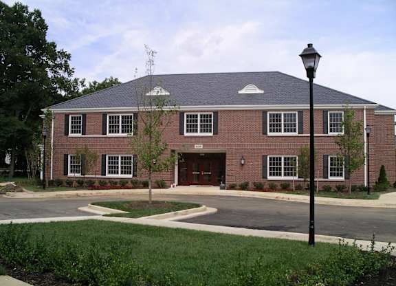 a brick building with a street light in front of it