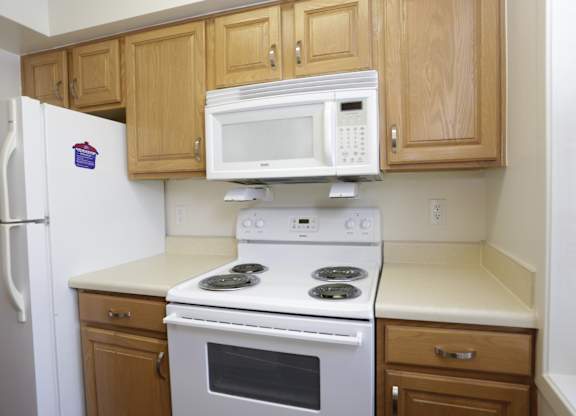 a kitchen with a stove microwave and refrigerator