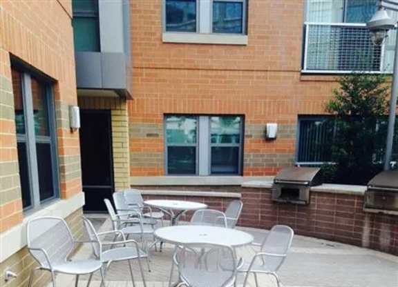 A patio with a table and chairs.