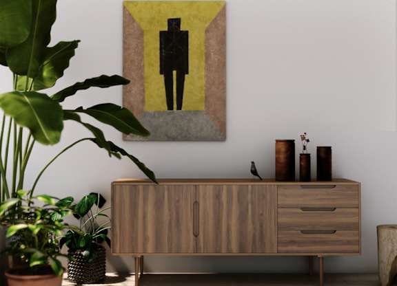 A painting of a person is hanging on a wall above a wooden cabinet.