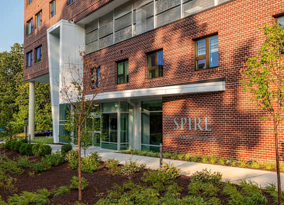 a large brick building with the word spire on it