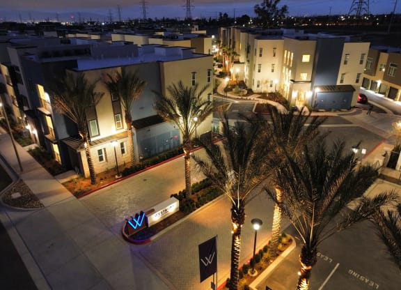 an aerial view of a street with apartments at night  at Westbury Apartments, Rancho Cucamonga, CA