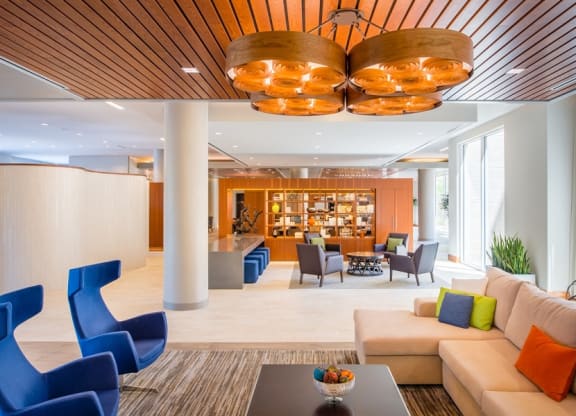 a lobby of a hotel with couches and chairs at The Metropolitan Downtown Columbia, Columbia, MD