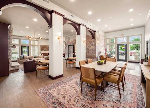 A large dining room with a table set for six.