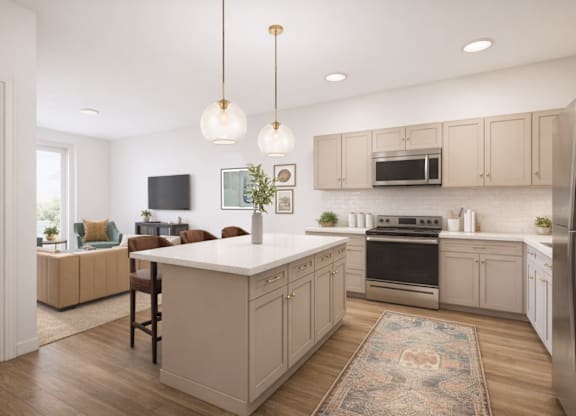 A kitchen with a white island and wooden floors.