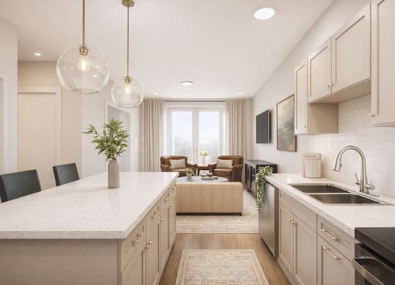 A modern kitchen with a large island and pendant lights.