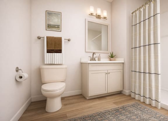A white toilet with a brown towel on top of it.