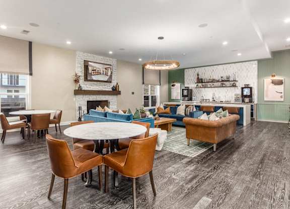 A modern living room with a fireplace and a dining table.