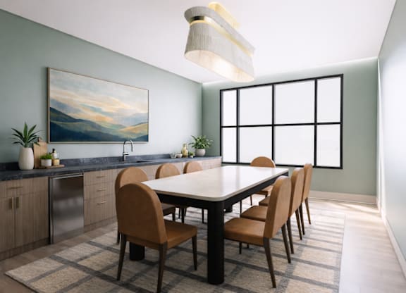 A dining room with a table and chairs.