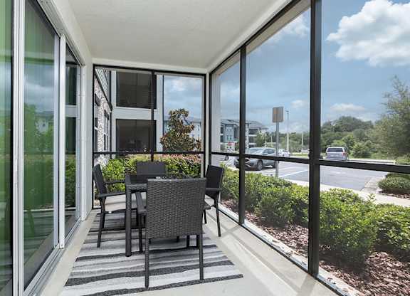 A patio with a table and chairs is shown.