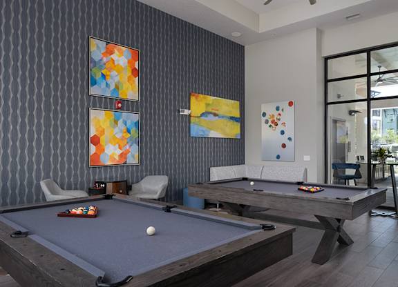 A pool table with a white ball on it.