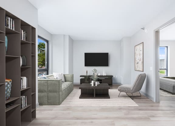 a living room with a couch and a coffee table and a television