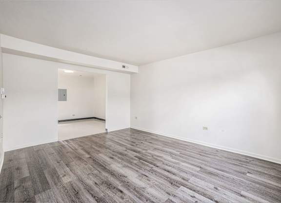 A room with a grey floor and white walls.