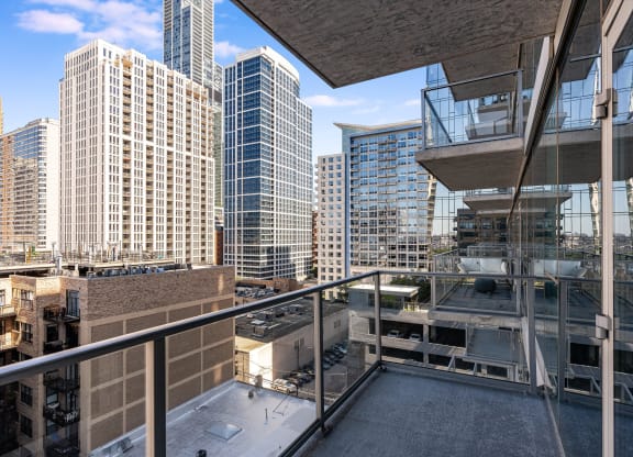 views of the city from the balcony of a high rise condo at One 333, Chicago, 60605
