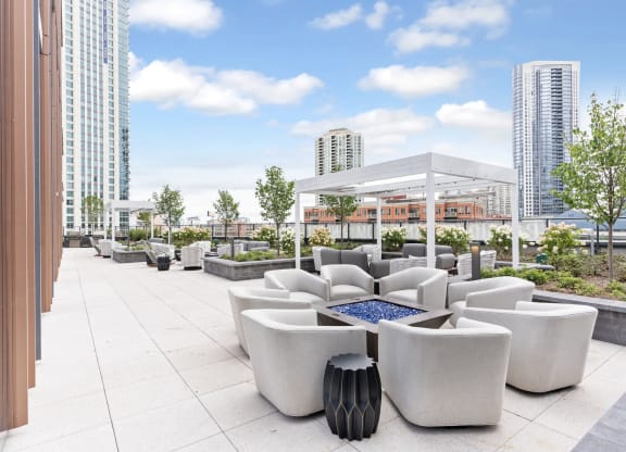 a rendering of a rooftop patio with couches and afire pit  at Cassidy on Canal, Chicago, 60606