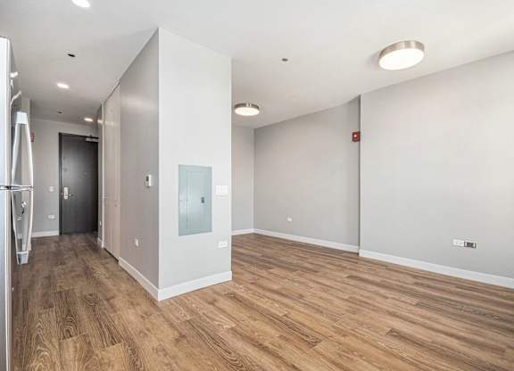 Spacious room with wooden flooring and white walls at Thrive Exchange, Chicago, IL, 60617