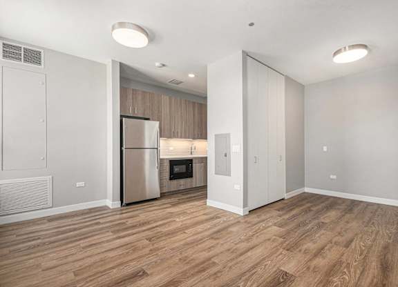Kitchen with a refrigerator, oven, and microwave at Thrive Exchange, Chicago, 60617