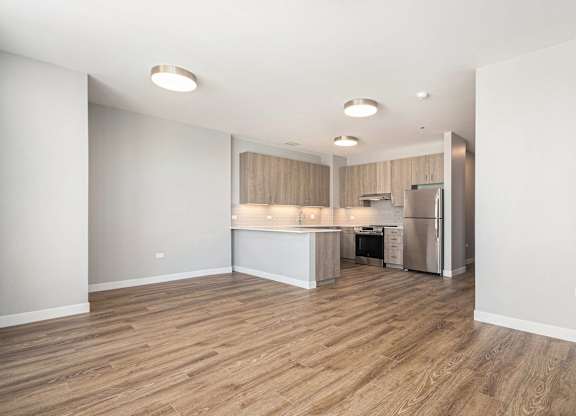 Kitchen with a refrigerator, sink, and cabinets at Thrive Exchange, Illinois