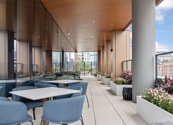 a terrace with tables and chairs and a building in the background at Cassidy on Canal, Chicago, IL, 60654