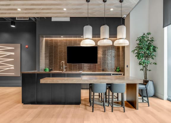 a kitchen with a large island and a table with chairs  at Cassidy on Canal, Chicago