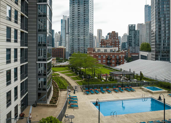 An aerial view of Kingsbury Plazas outdoor elevated pool deck with a view of the city at Kingsbury Plaza, Illinois