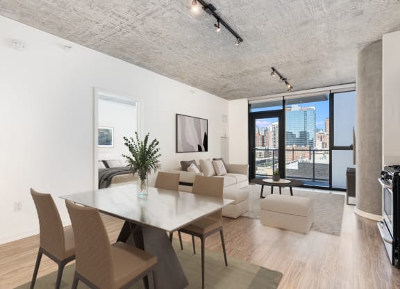 a living room with a table and chairs and a couch at One 333, Chicago, Illinois, 60605
