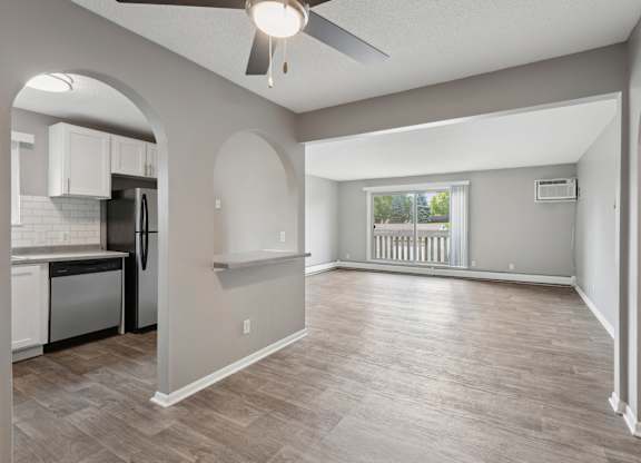 Open concept living room with kitchen at Cedarvale Highlands Apartments, Eagan, MN