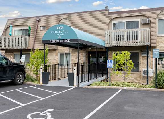 Rental office entrance with covered walkway at Cedarvale Highlands Apartments, Eagan, 55122