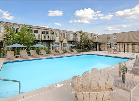Swimming pool with lounge chairs at Cedarvale Highlands Apartments, Minnesota, 55122