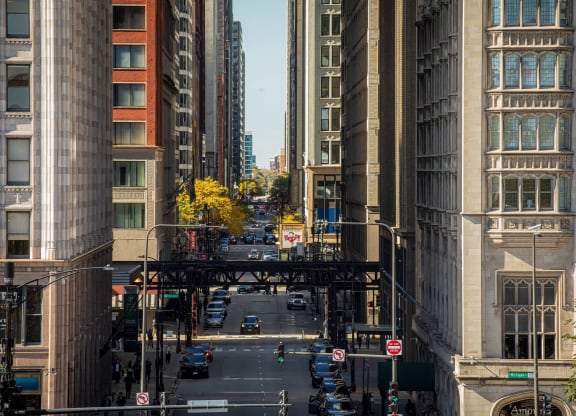a view of a city street with tall buildings and a bridge at Columbus Plaza, Chicago, 60601