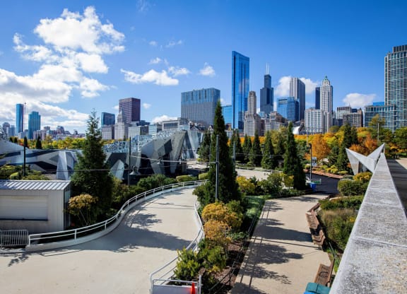 a view of a park with a city in the background at Columbus Plaza, Chicago